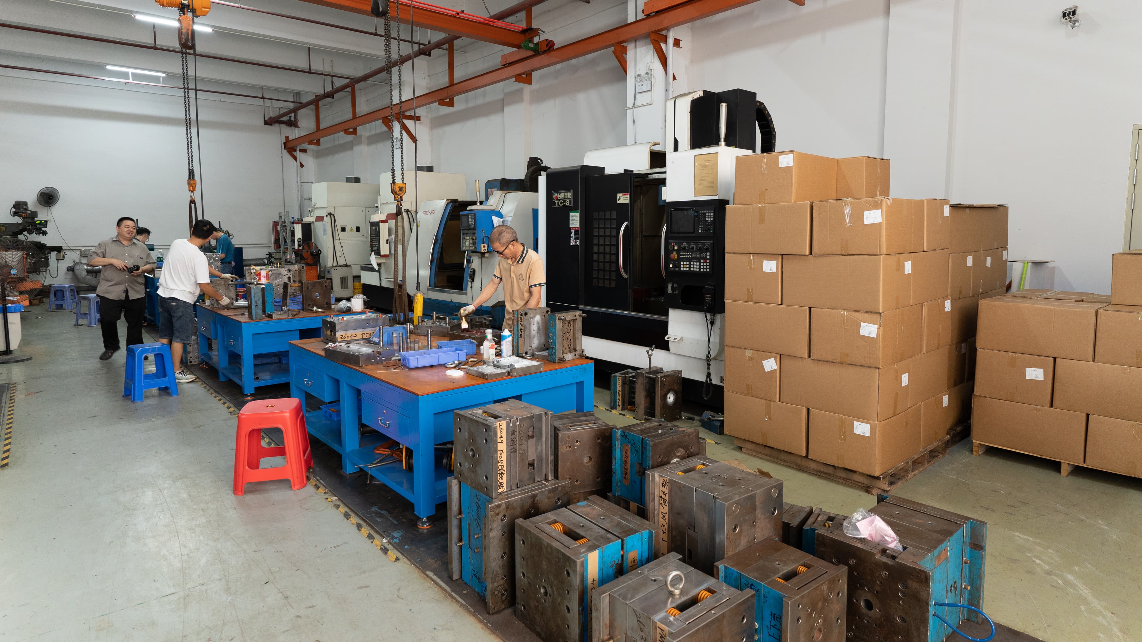 Technicians working with tooling in BaiChang’s mold workshop